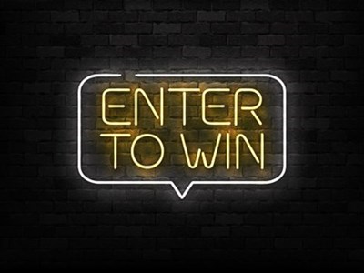 Enter To Win sign in neon yellow light on a black brick wall - FANCLB For Creators